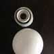 Vintage globe wall lamp in white opaline with white ceramic base