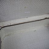 Cardboard and brown leather case