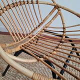 Vintage rattan shell armchair from the 60s
