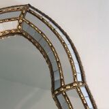 Mirror consisting of multi-faceted mirrors and brass garlands, French work, around 1970