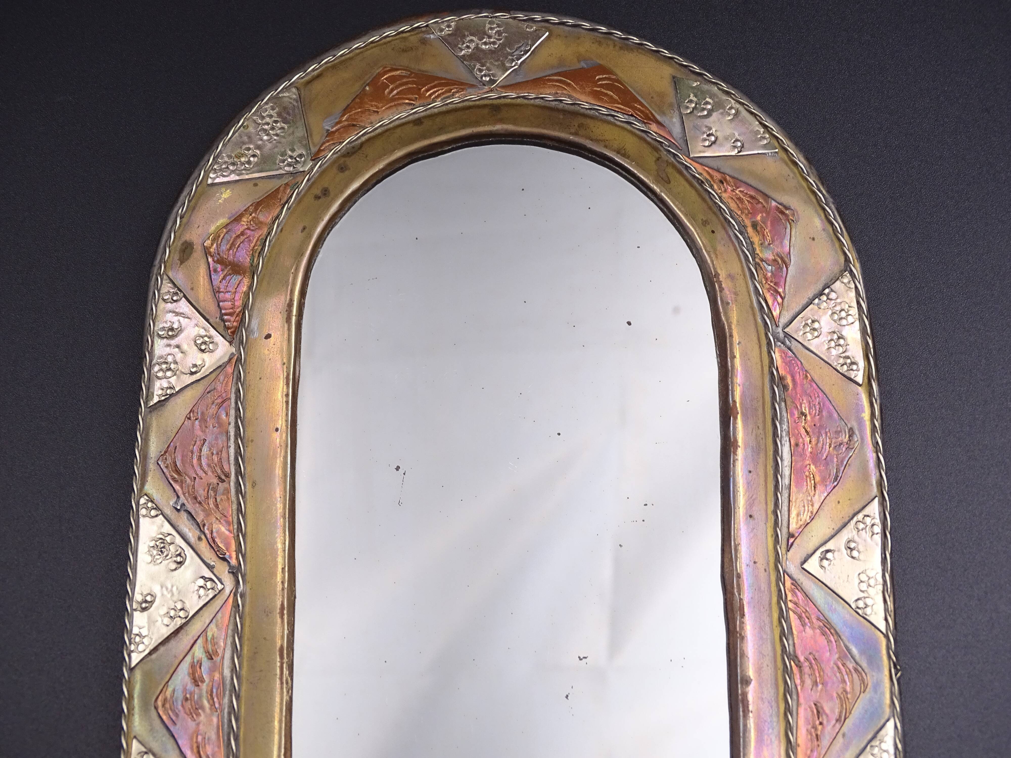 Oriental mirror in worked copper 24x15cm