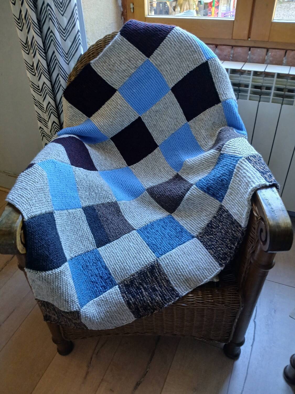 Hand knitted patchwork plaid
