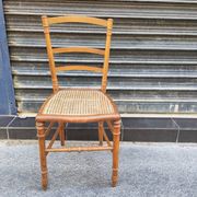 Antique wooden chair with cane seating