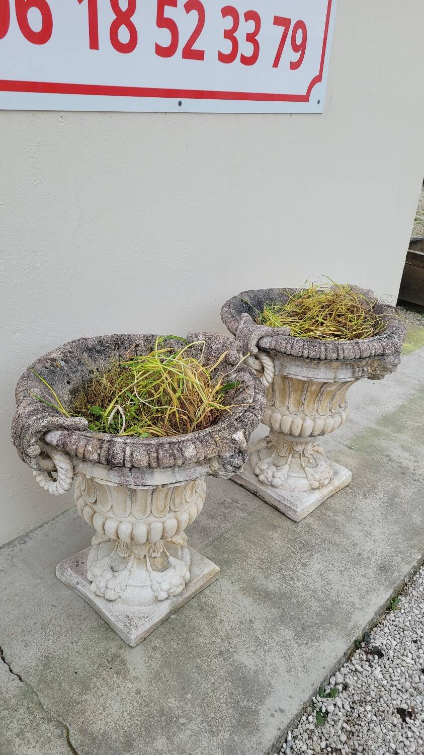 Pair of planter vases decorated with faces in reconstituted stone 1950s