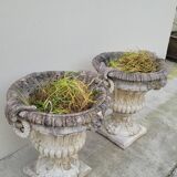 Pair of planter vases decorated with faces in reconstituted stone 1950s