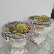 Pair of planter vases decorated with faces in reconstituted stone 1950s