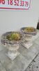 Pair of planter vases decorated with faces in reconstituted stone 1950s