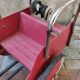 Old pedal car in tole fire truck