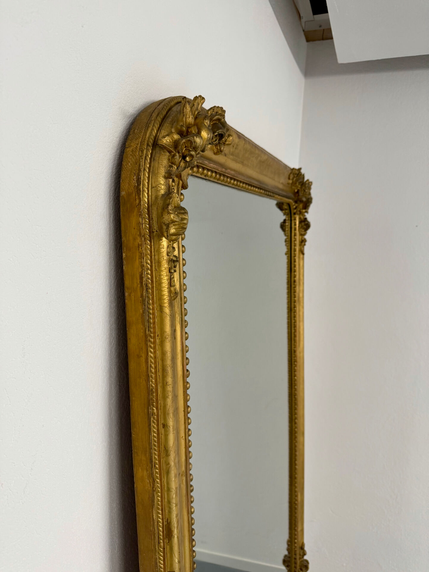 Large Napoleon III mirror with wooden gilded frame, 19th century, 200 cm.