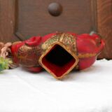 A pair of red and gold ceramic vases in the shape of elephants, 1940s.