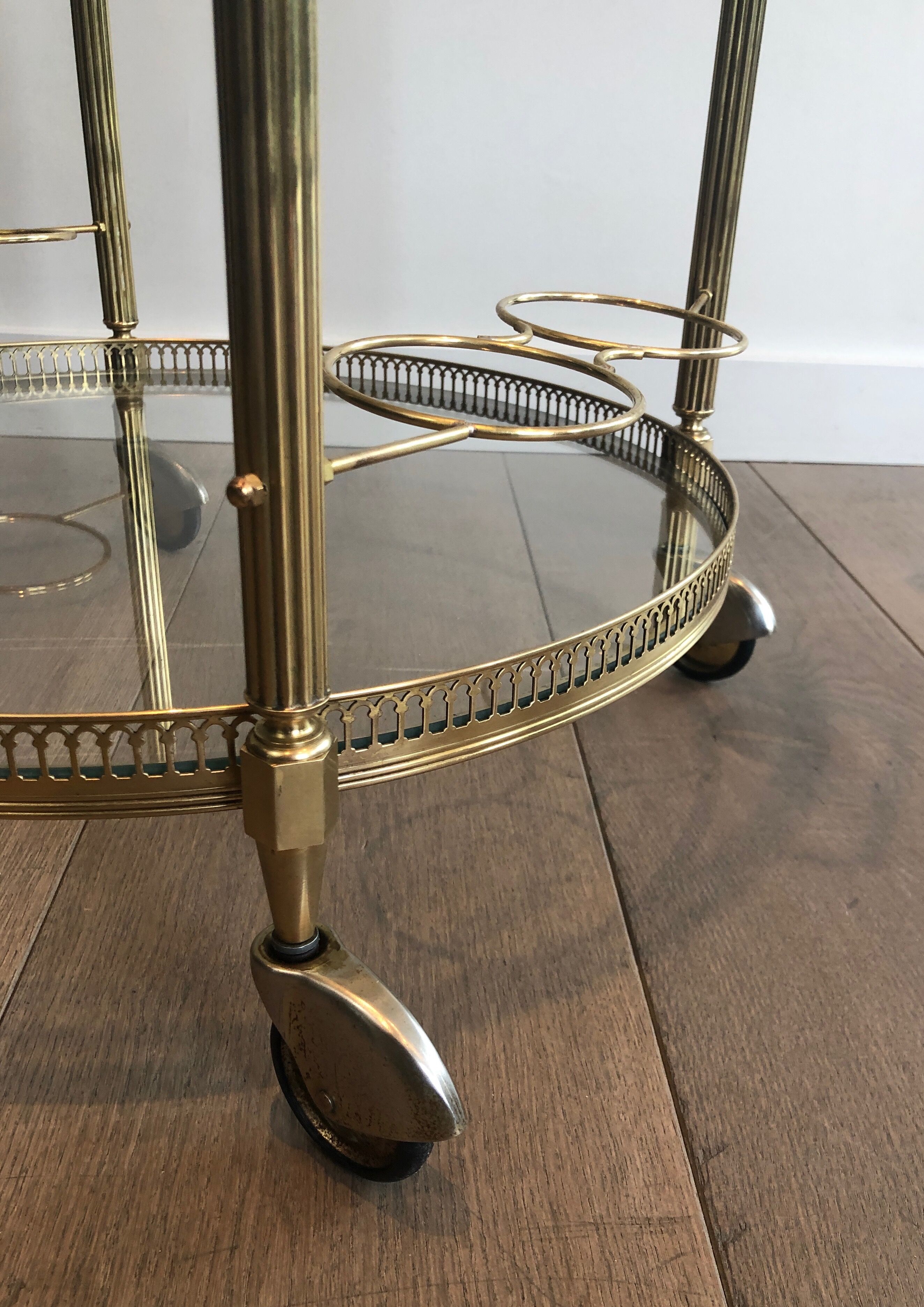 Neoclassical style rolling table in brass