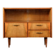 Old TV cabinet with brass handles.