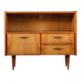 Old TV cabinet with brass handles.