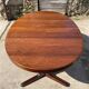 Baumann round oval extendable Scandinavian table in rosewood with 2 extensions.