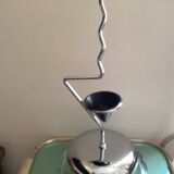 Designer umbrella stand in chrome metal and wood.