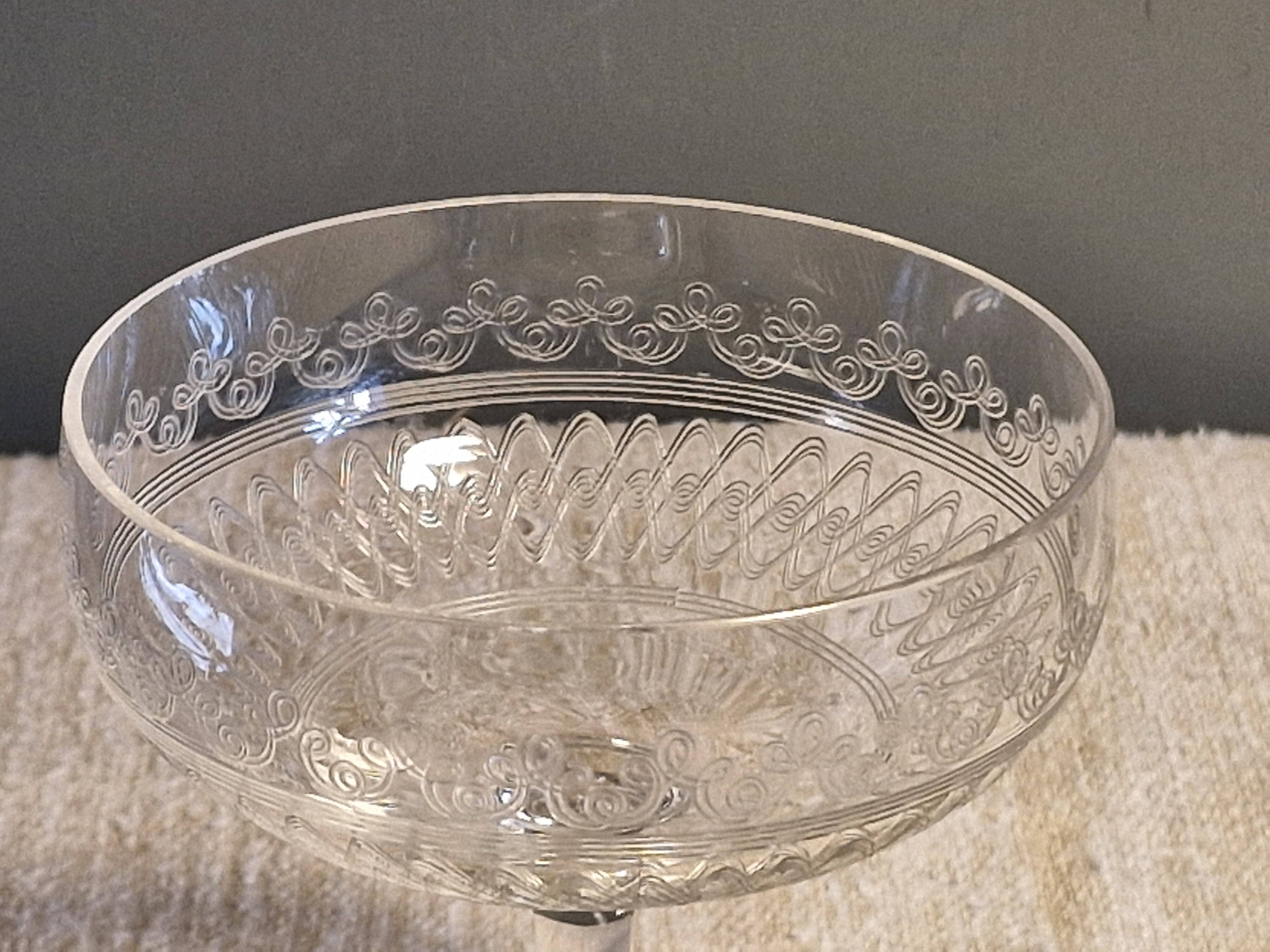 8 antique Baccarat crystal champagne coupes with engraved decoration.