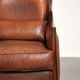 Sheepskin Art Deco design armchair with a comfortable seat and warm colours