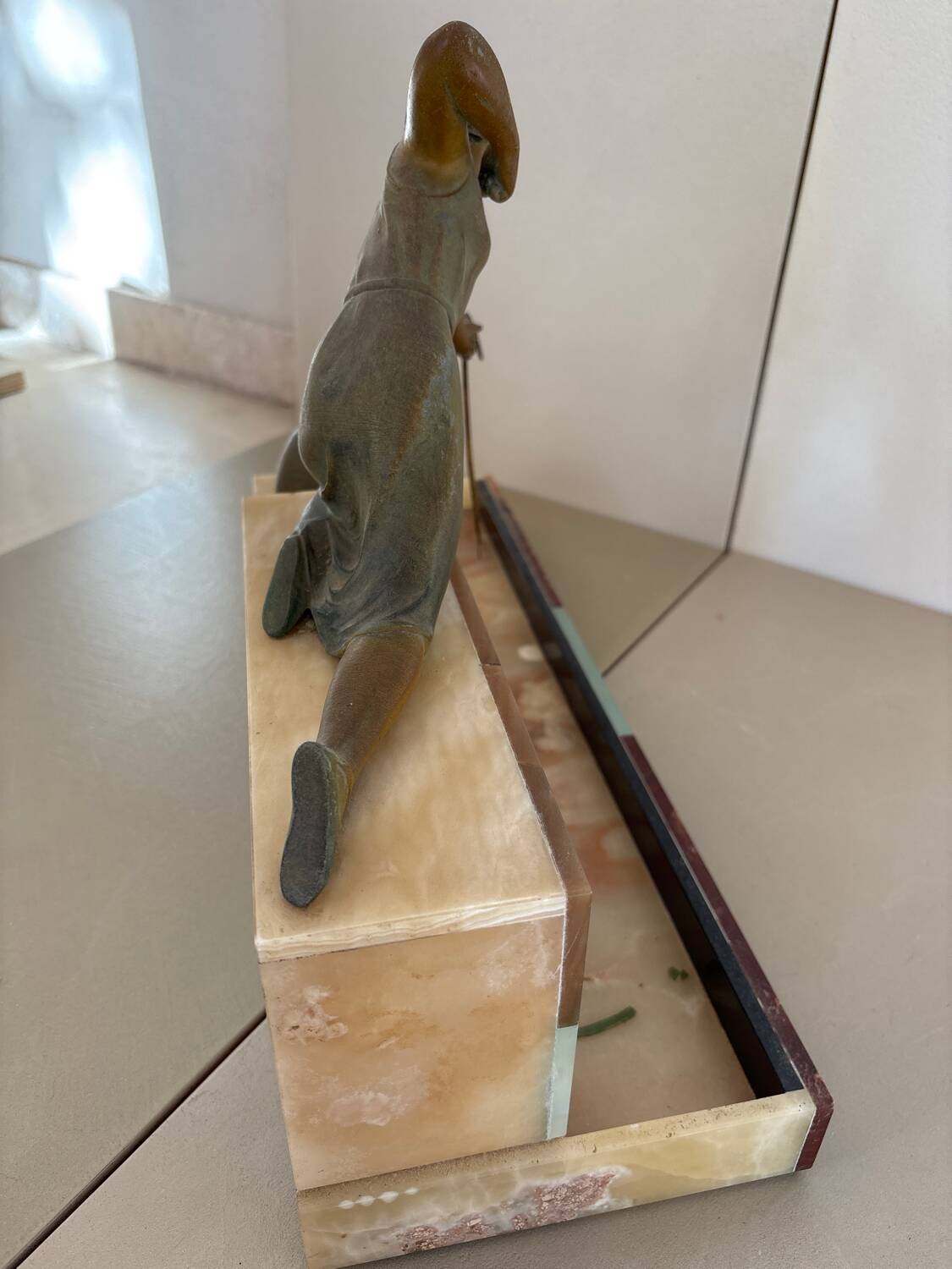 Sculpture of a woman with a greyhound