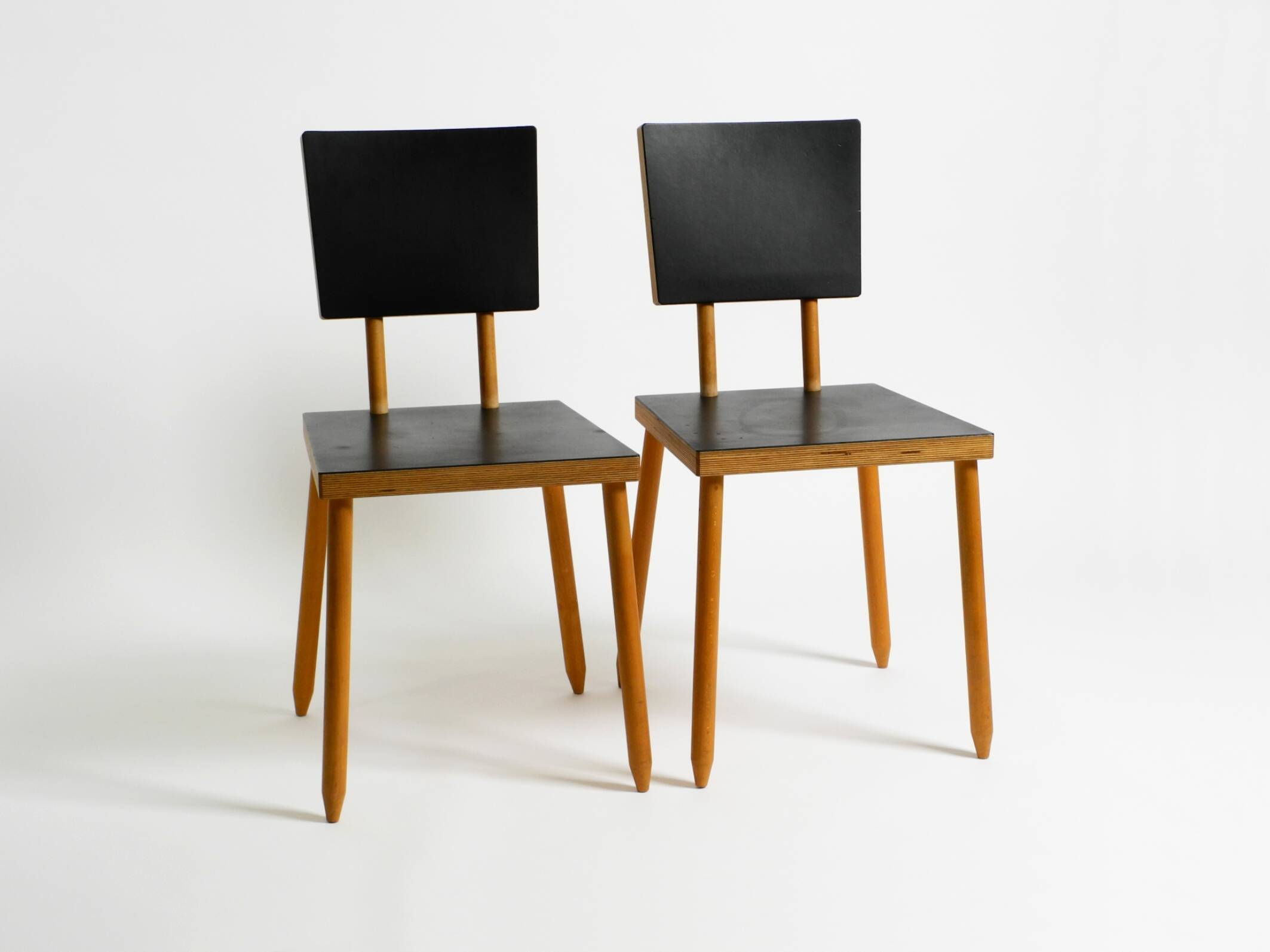 Two rare demountable plywood chairs by Axel Kufus model Stöcke for Atoll
