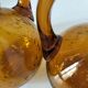 Duo of blown glass carafes – Biot signed – Bubbled amber glass