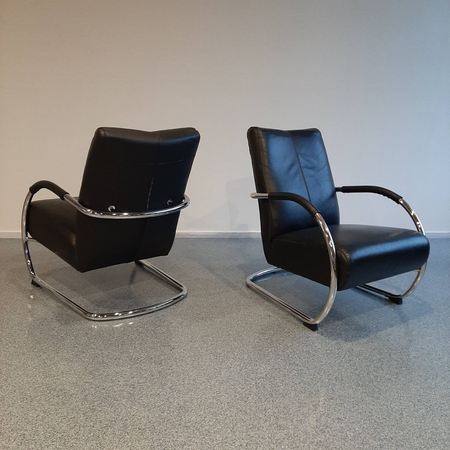 Pair of tubular armchairs