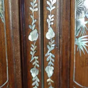 Asian screen in carved wood and mother-of-pearl marquetry.