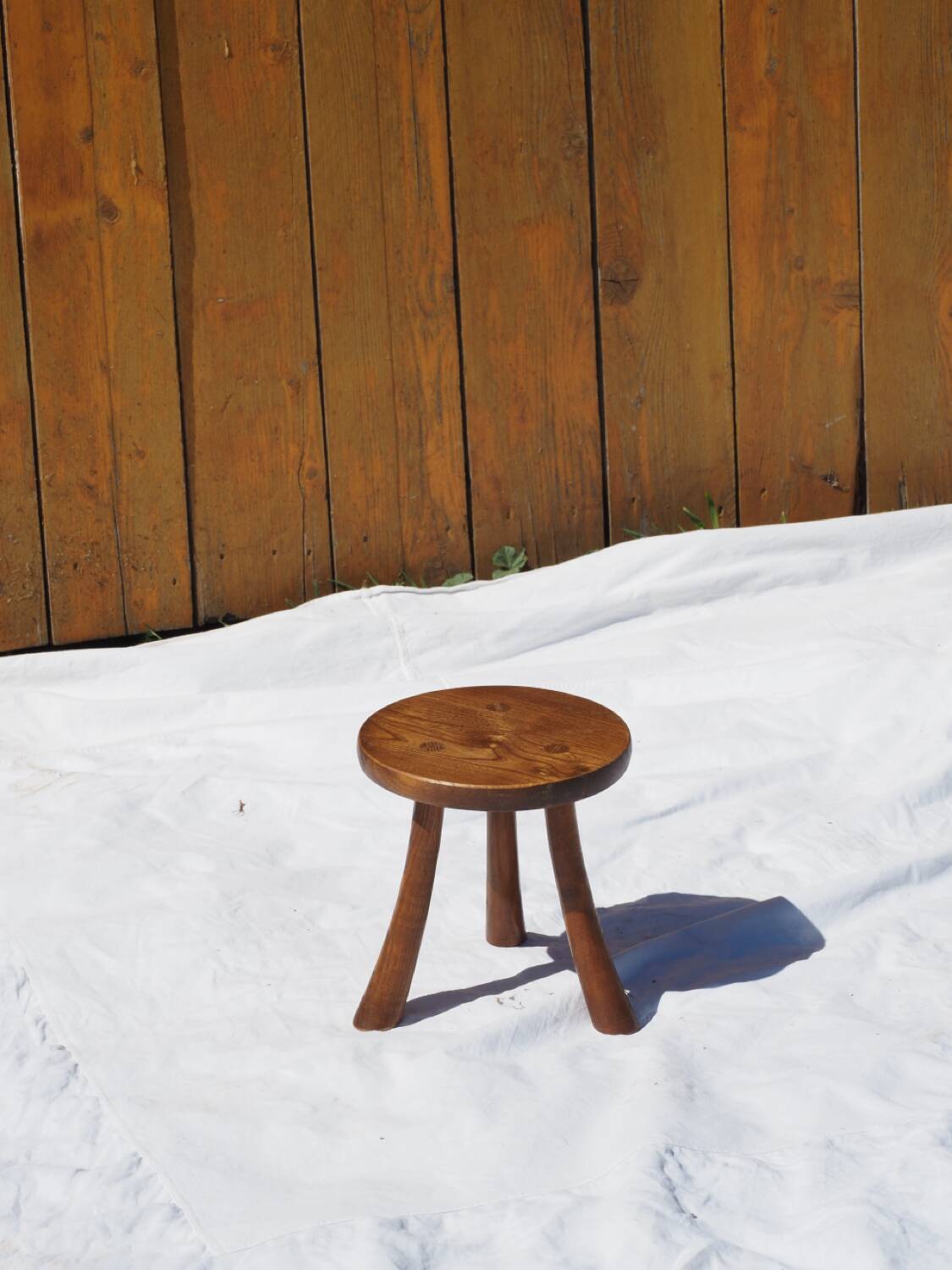 Old rustic milking stool