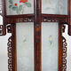 Asian wooden lantern carved with dragons and painted glass panels
