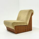 Vintage mid-century beige armchair with wooden frame and ottoman