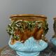 Paire de cache-pots en barbotine à décor de mascarons, XIXe siècle