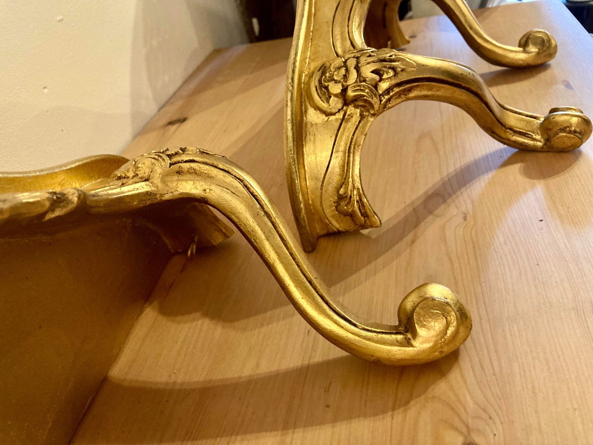 Pair of gilded wall shelves