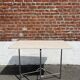 Folding table with chrome and pink formica.