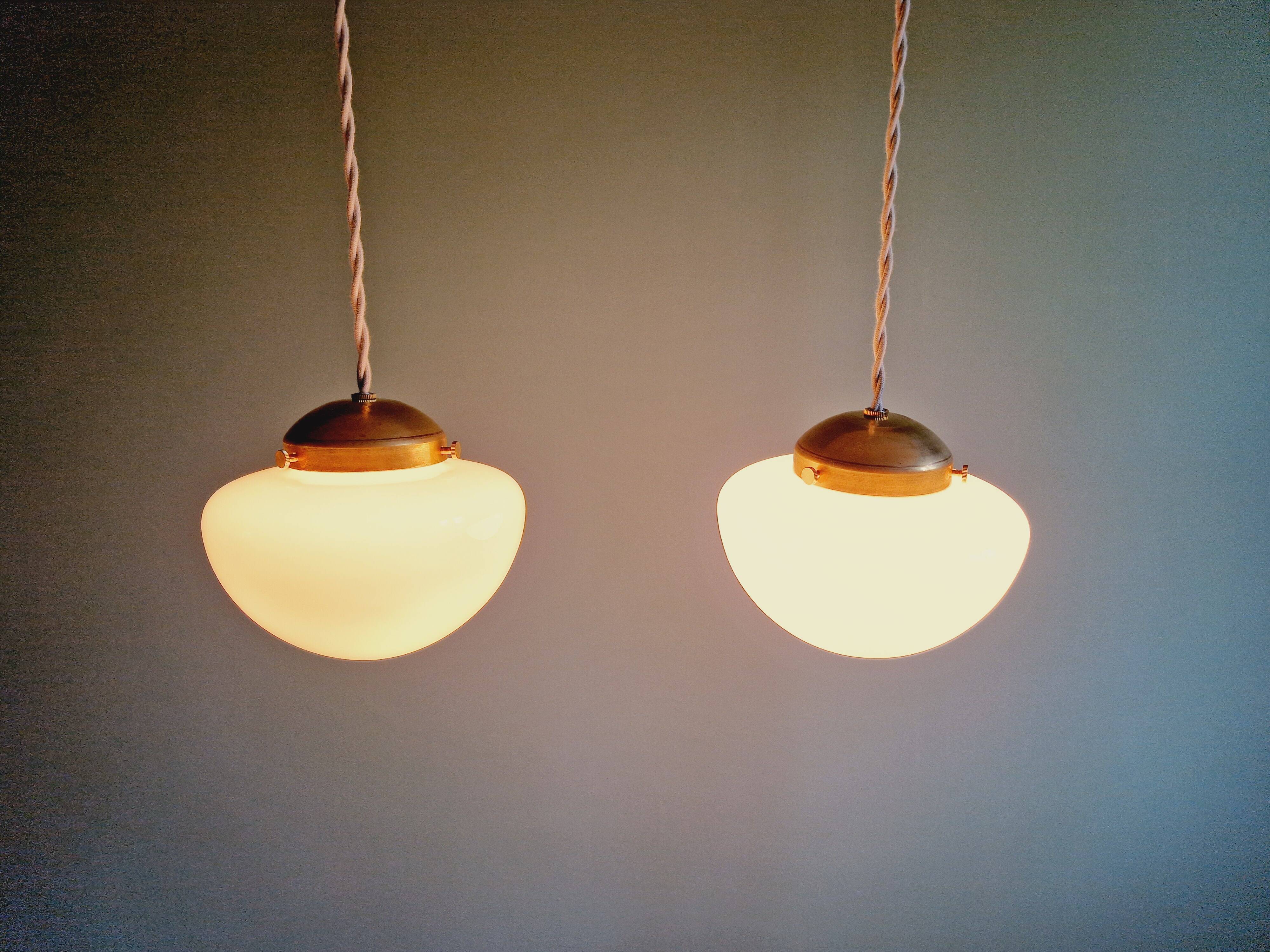 Duo of Art Deco suspensions in white opaline, 1920s-30s