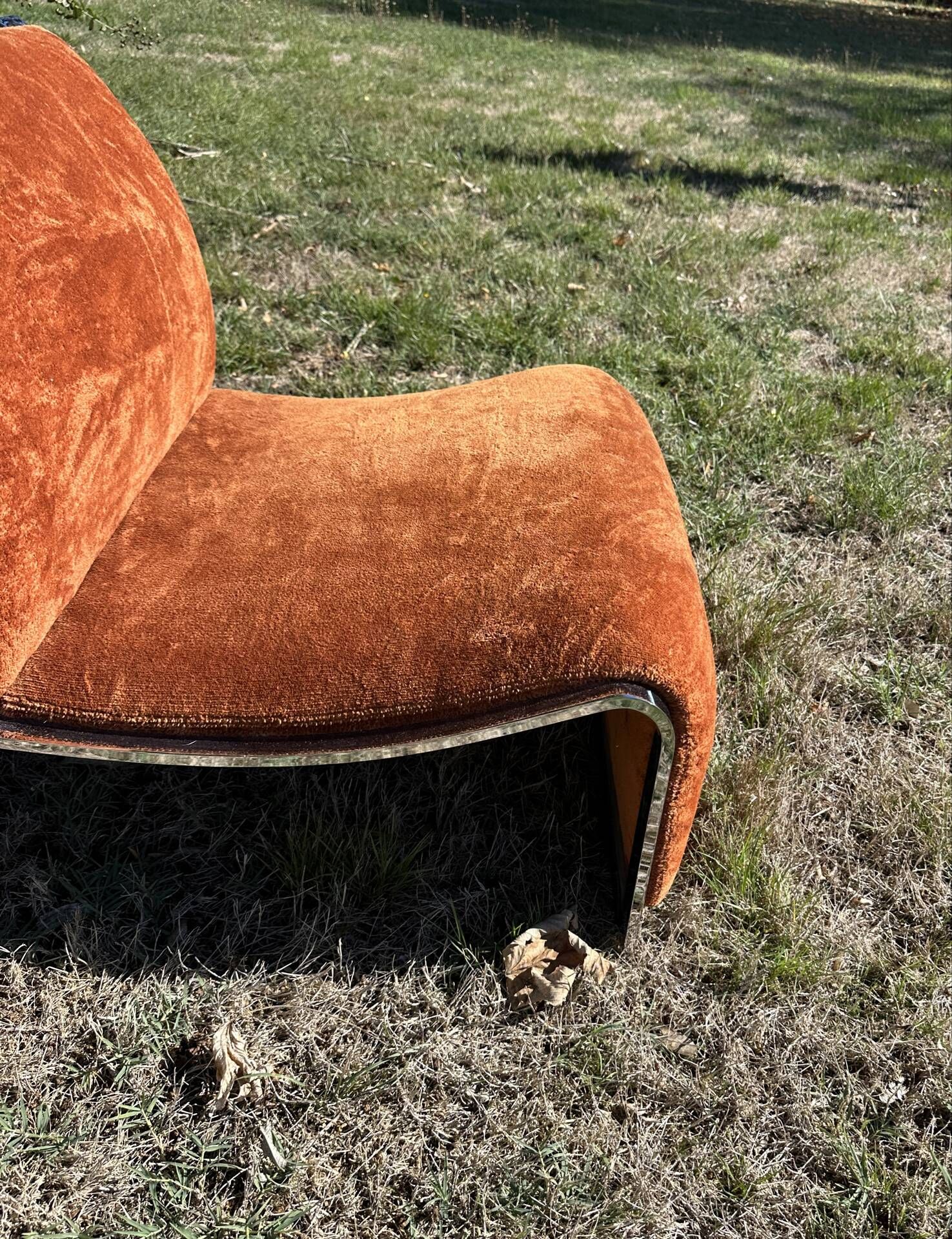 Chrome steel armchair and orange fabric by Vittorio Introini