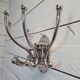 Circular chromed metal coat rack