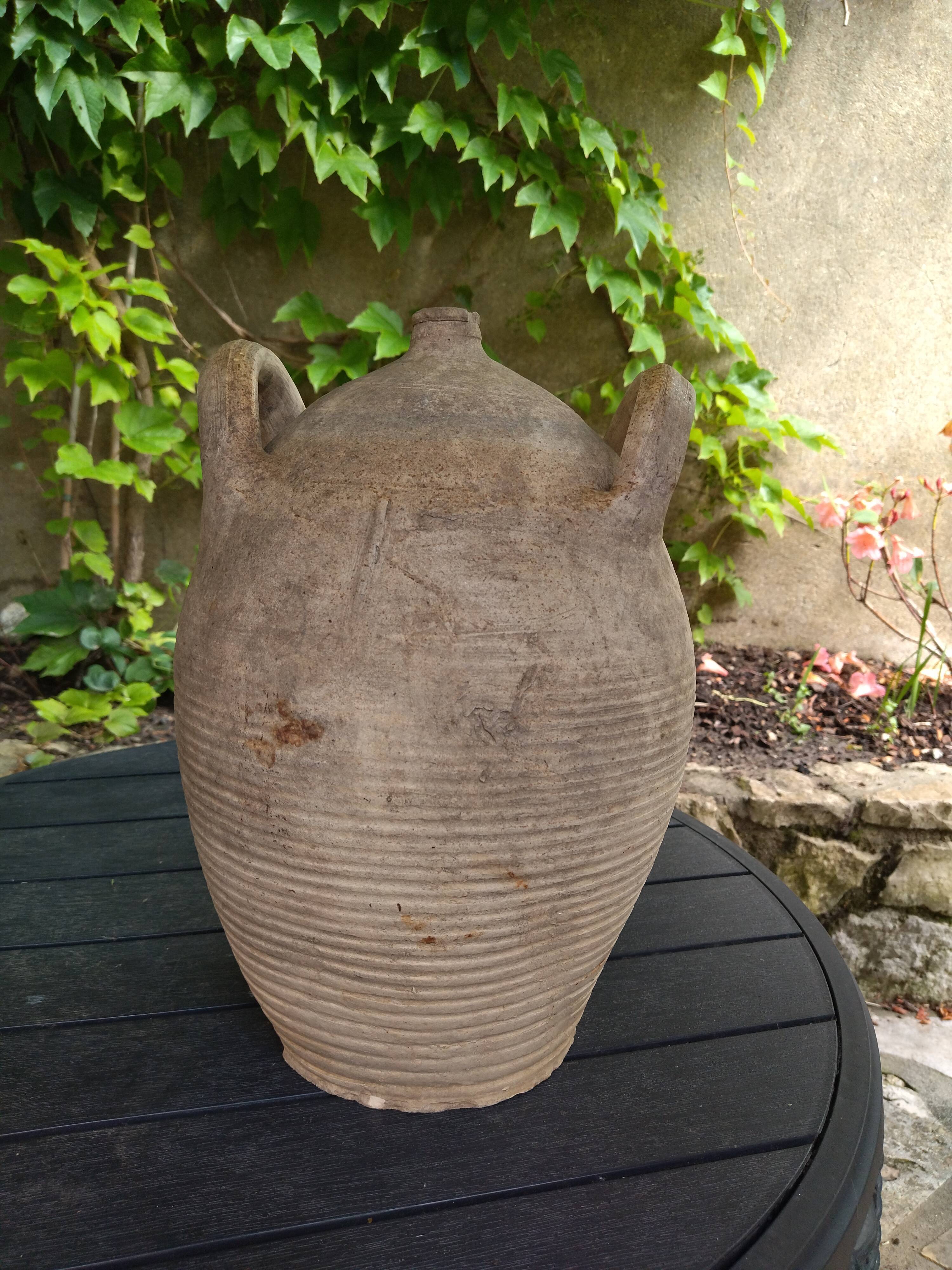 Ancient sandstone jar with two handles