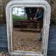 Antique mirror with carved wooden frame