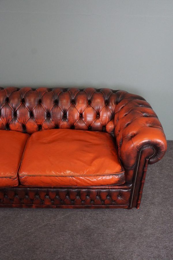 Chesterfield sofa in patinated orange leather, 2.5 seats