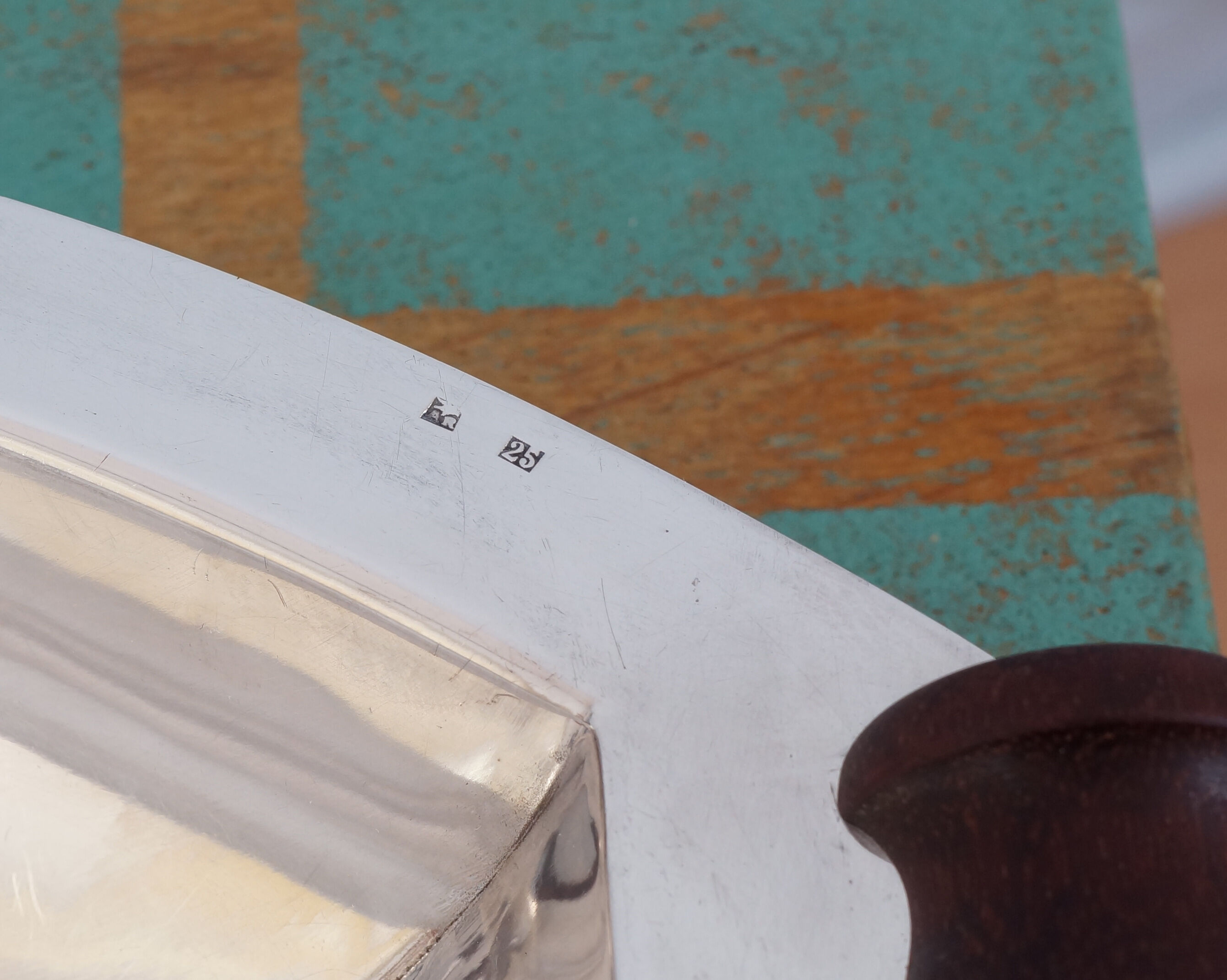 Silver plated metal hollow dish and mahogany handles