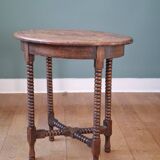 Candle holder side table with spool legs