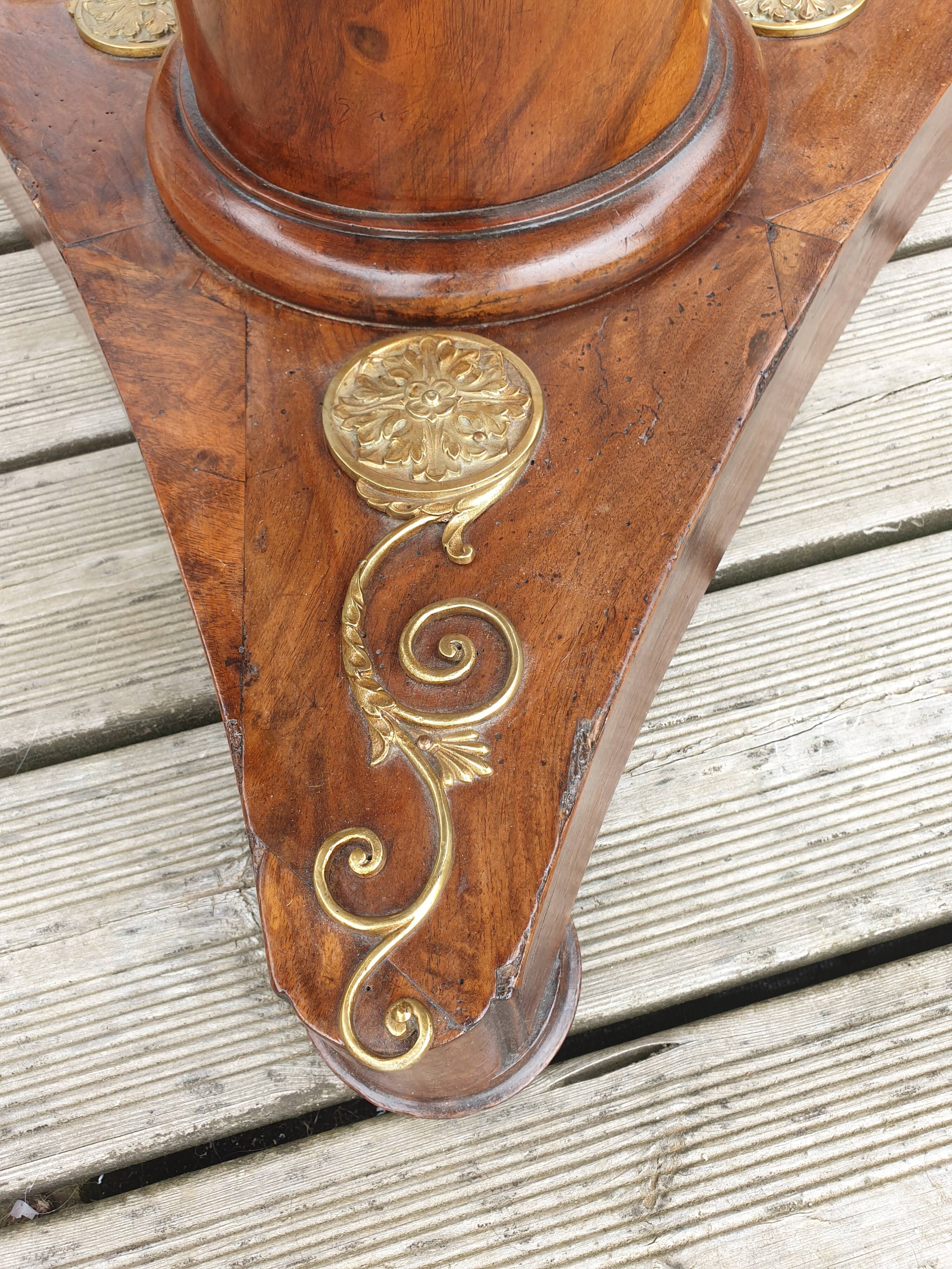 Pedestal table above marble