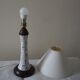 Table lamp for bedside use in earthenware with a wooden base.
