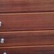 Vintage golden oak chest of drawers with 4 spindle feet from the 1950s