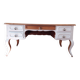Solid wood desk with distressed white paint.