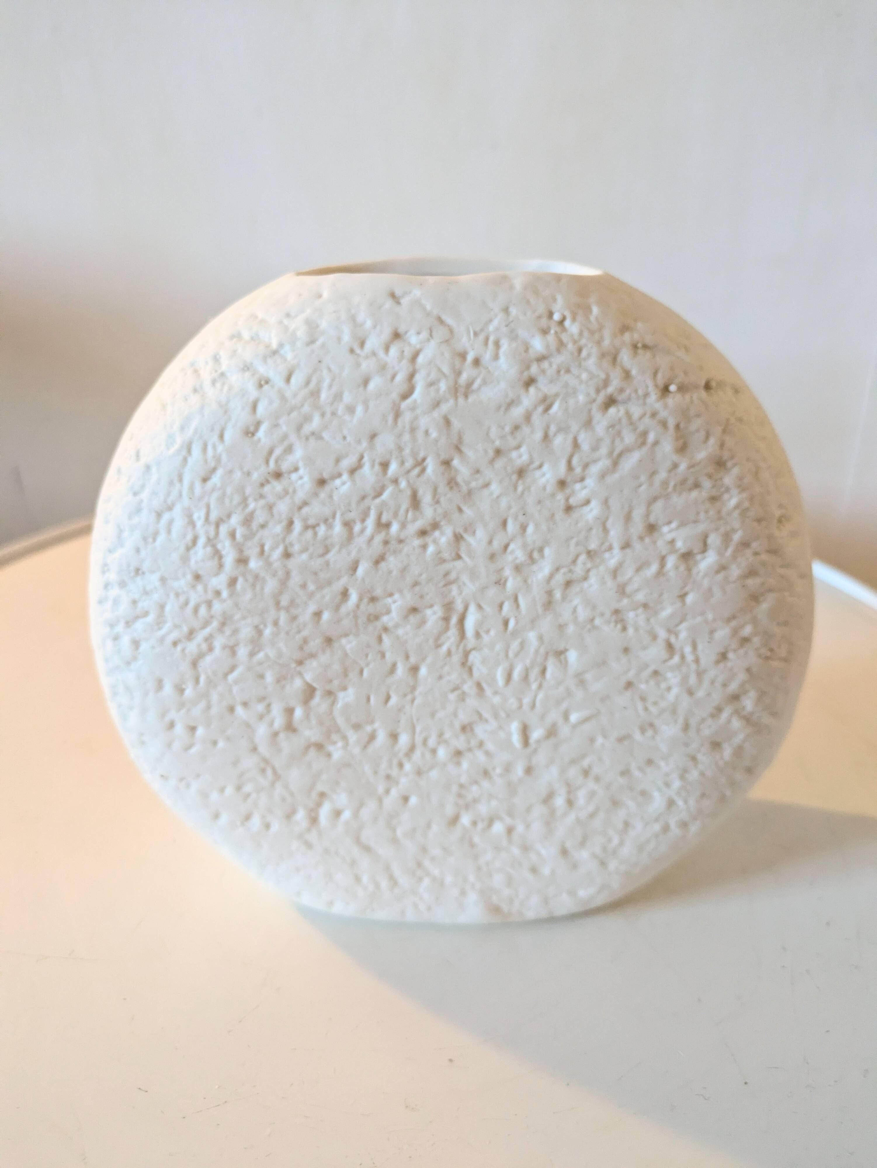 Stylized face biscuit vase
