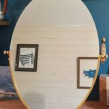 Oval mirror patinated brass frame art deco
