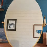 Oval mirror patinated brass frame art deco