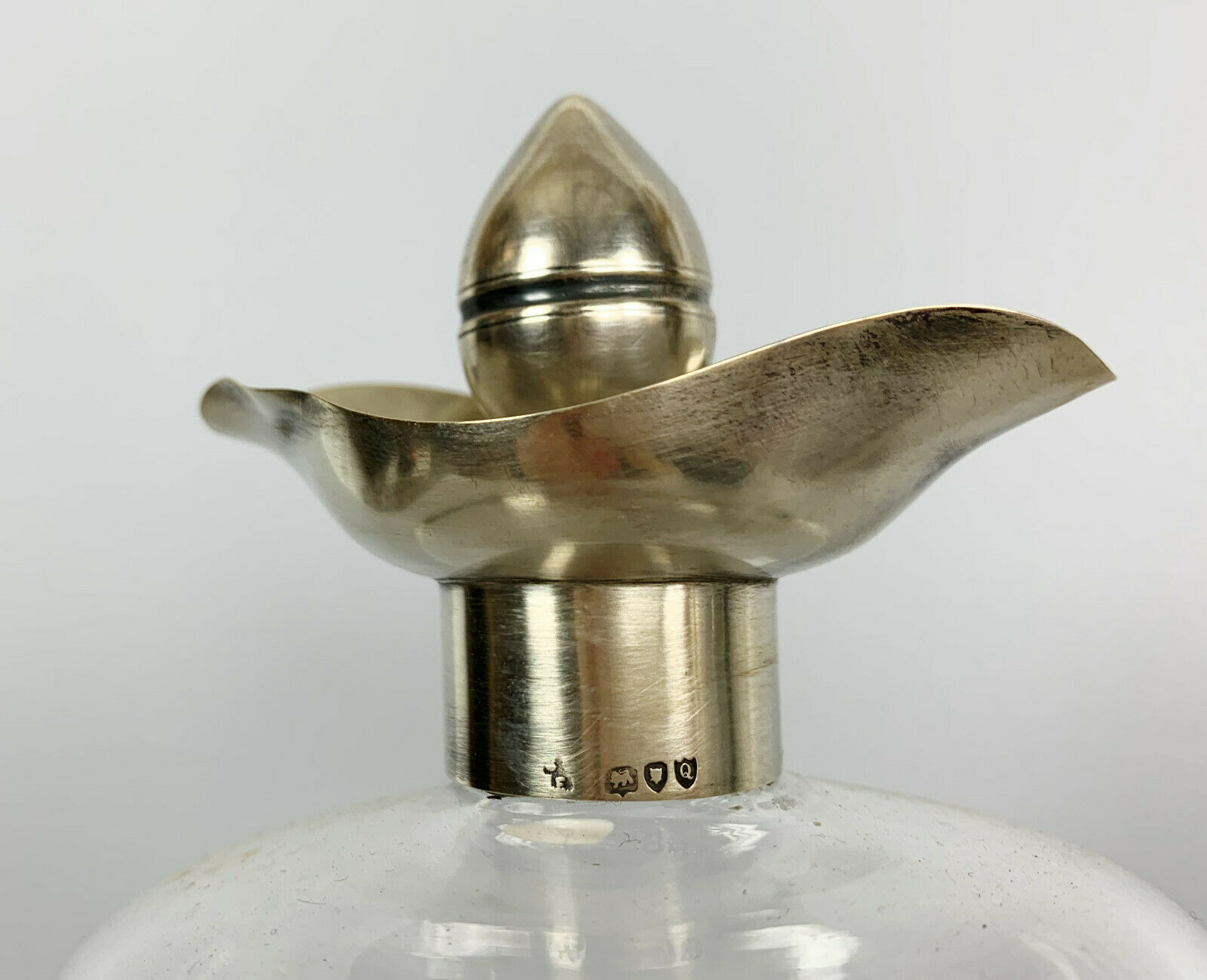 Blown glass carafe with silver frame and cap