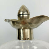 Blown glass carafe with silver frame and cap