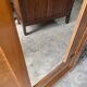 Vintage Parisian wardrobe with one mirrored door from the 60s in pine and wood